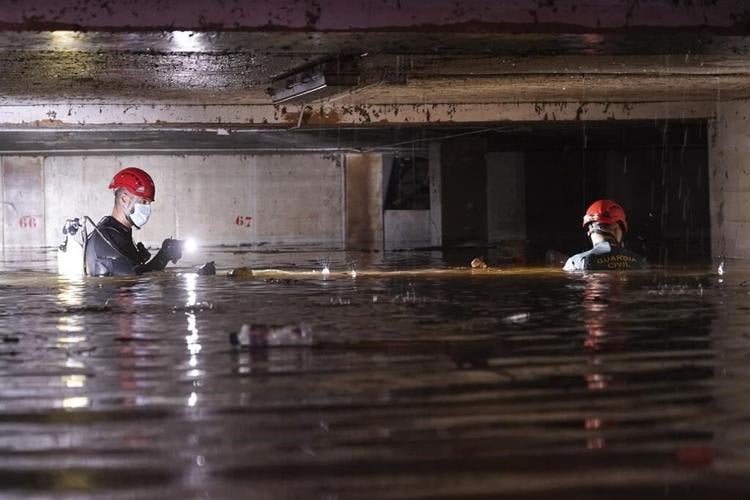 Heavy rains in Barcelona disrupt rail service as troops search for more flood victims in Valencia