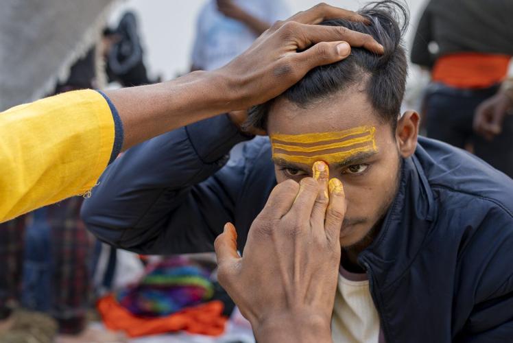 Sacred strokes of color on foreheads are a major display of Hinduism at India’s Maha Kumbh festival