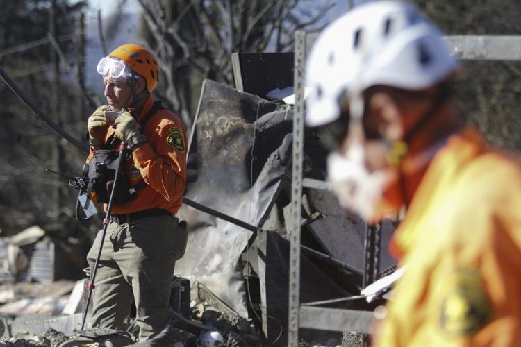 New wildfire warnings issued and more power is shut off as winds rise in Southern California