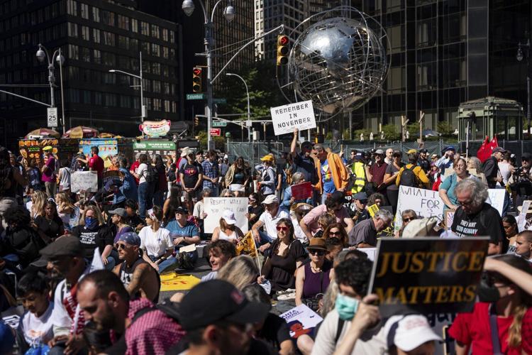 Marchers gather in worldwide protest of financial institutions "profiting off the climate crisis"