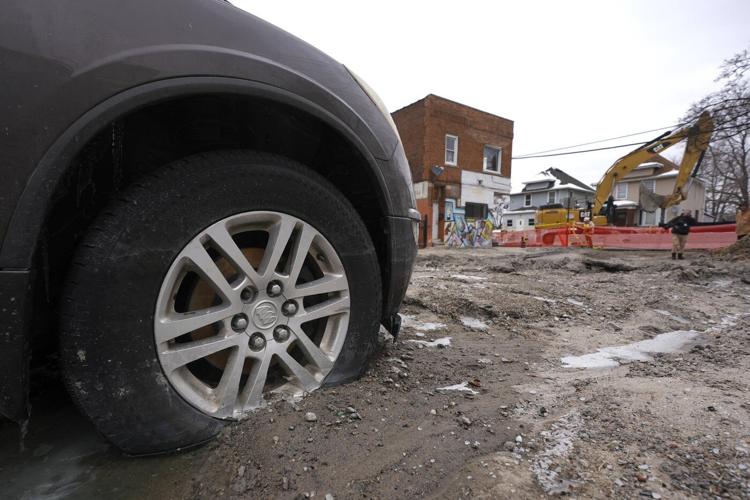 Detroit crews are working to fix a broken water main that flooded dozens of homes