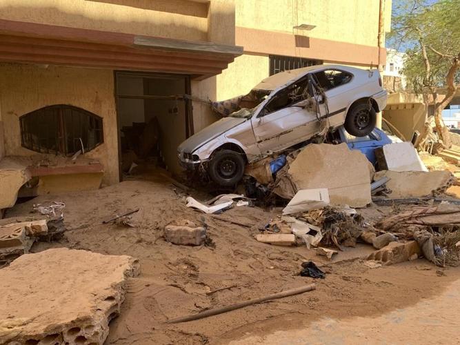 Libyan city closed off as searchers look for 10,100 missing after flood deaths rise to 11,300