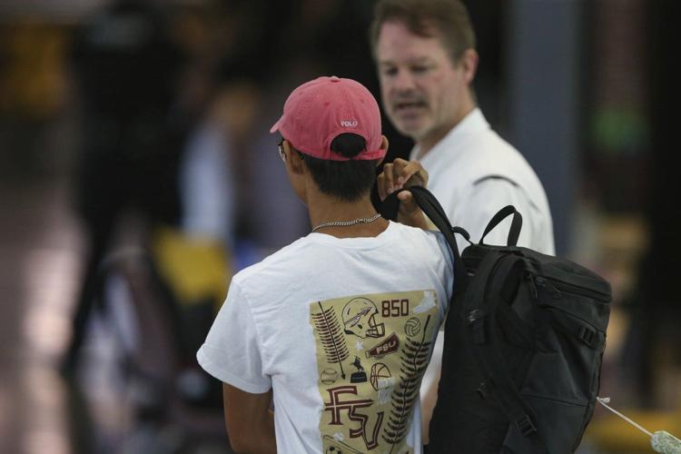 Questions emerge about how a deputy's stepson became the accused gunman in deadly FSU shooting