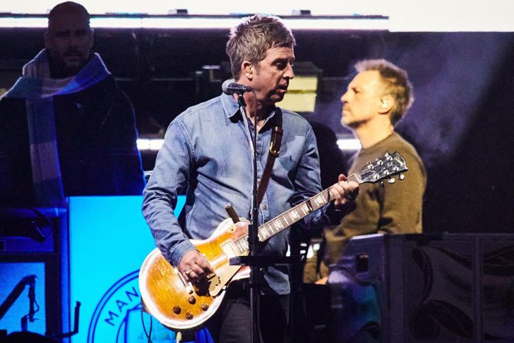 Drenched and nostalgic, Oasis marks Toronto return amid sudden downpour