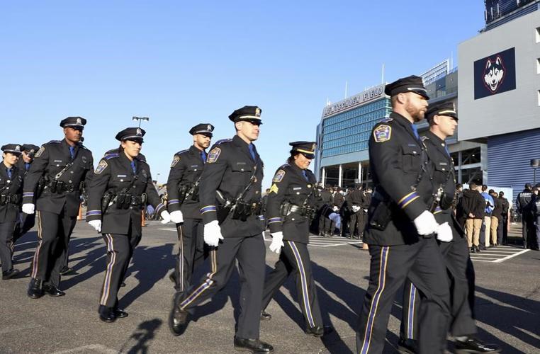 Funeral for 2 ambushed officers draws peers from around US