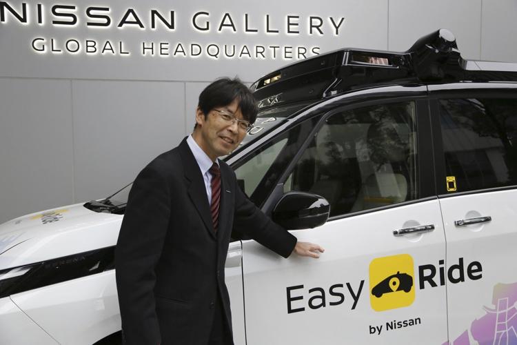 Japan's Nissan tests driverless vehicles in city streets filled with cars and people