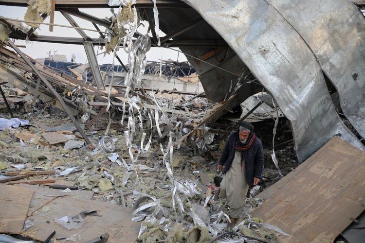 Rescue crews race through rubble after a deadly Kabul airstrike, in photos