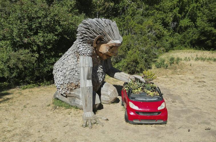 Giant trolls built from trash want to save humans from themselves