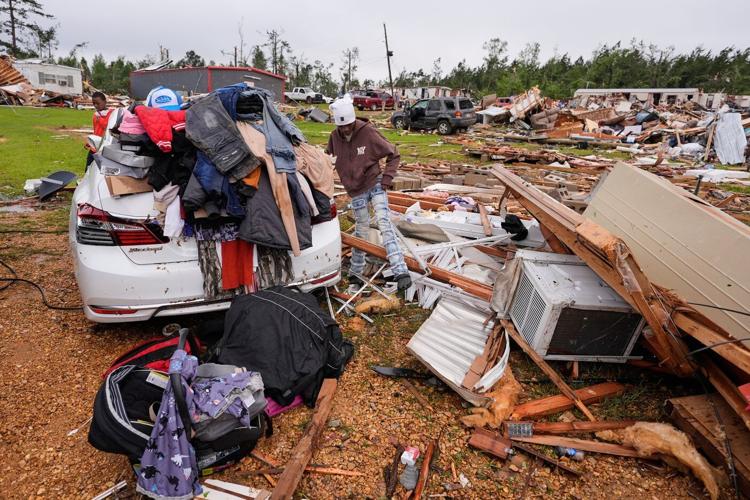 Survivors of Mississippi tornadoes crawled under furniture and held onto their kids