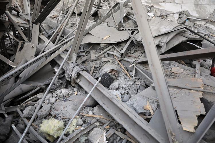 Rescue crews race through rubble after a deadly Kabul airstrike, in photos