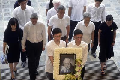 Lee Kuan Yew's youngest son says the UK has granted him asylum from persecution in Singapore