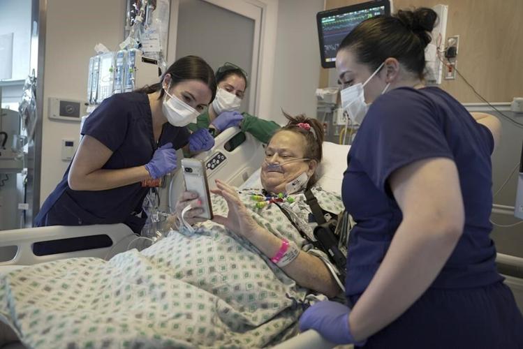 Doctors combine a pig kidney transplant and a heart device in a bid to extend woman's life