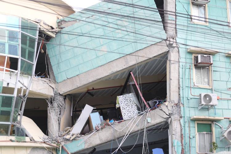 A 7.8 magnitude quake in the Philippines kills at least 32, collapses buildings and sparks tsunami