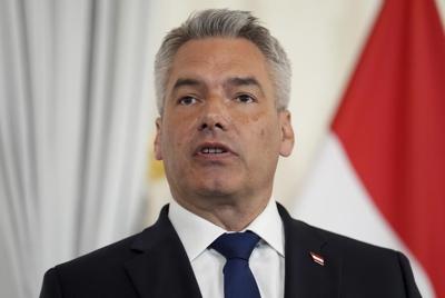Austrian chancellor to remain in government coalition despite his minister's controversial EU vote