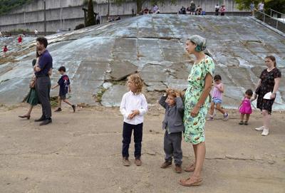 On heartland roads, and a riverboat, devout Catholics press on with two-month nationwide pilgrimage