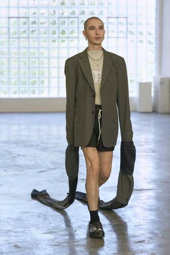 Simon Cracker creates a brand uniform to highlight star upcycled garments during Milan Fashion Week