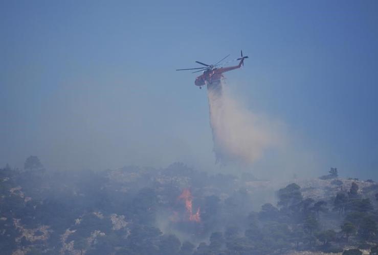 Firefighters in Greece struggle to control blazes in country's northeast and near Athens