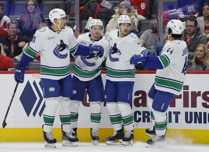 Jake DeBrusk scores hat trick, including OT game-winner, as Canucks top Red Wings 5-4