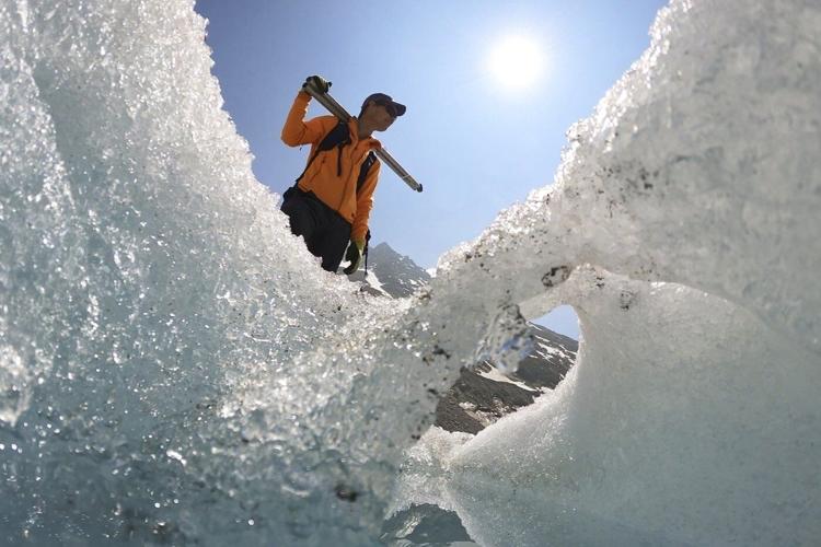 Switzerland's ebbing glaciers show a new, strange phenomenon: holes reminiscent of Swiss cheese
