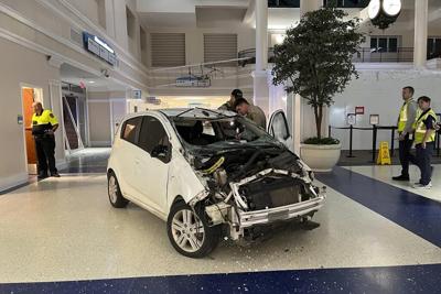 Sheriff: Vehicle crashes in airport terminal, driver charged