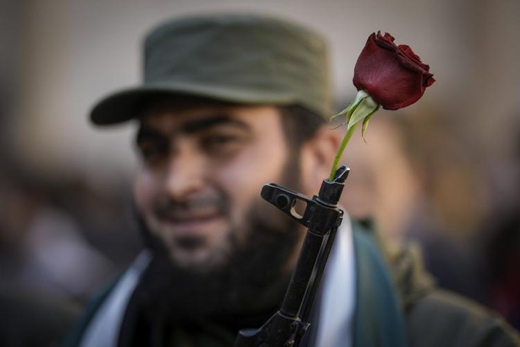 New Syria's 1st week: Rebels try to bring normalcy while Syrians vow to speak up