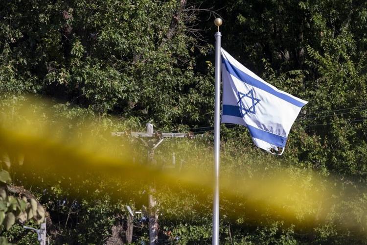 Man who tried to enter Jewish school with a gun fired twice at a construction worker, police say