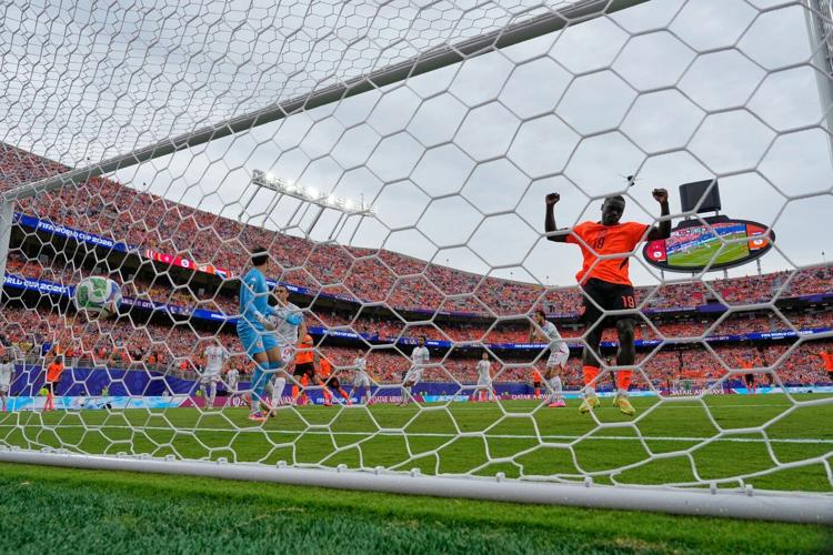 Brian Brobbey and the Dutch roll in the rain to a 3-1 win over Tunisia to top World Cup Group F