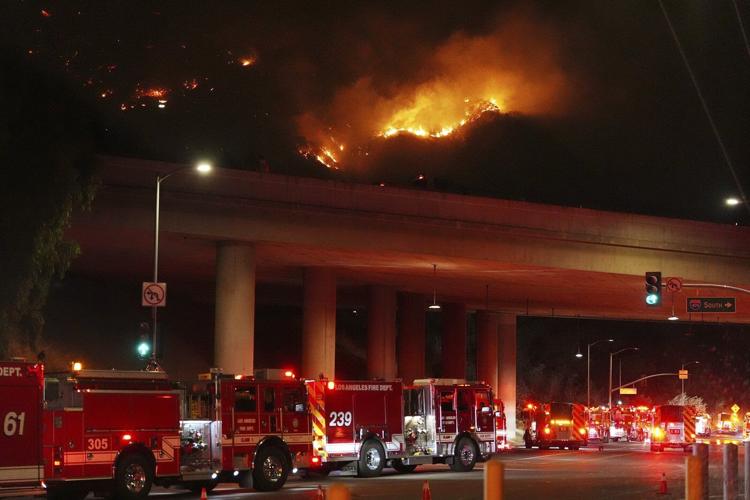 Aerial attack helps firefighters maintain the upper hand on a huge fire north of Los Angeles