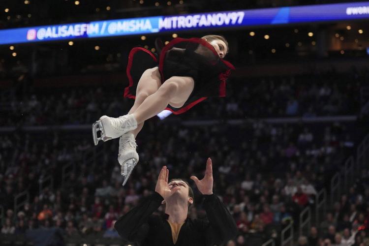 World figure skating championships pause to remember those who died in plane crash