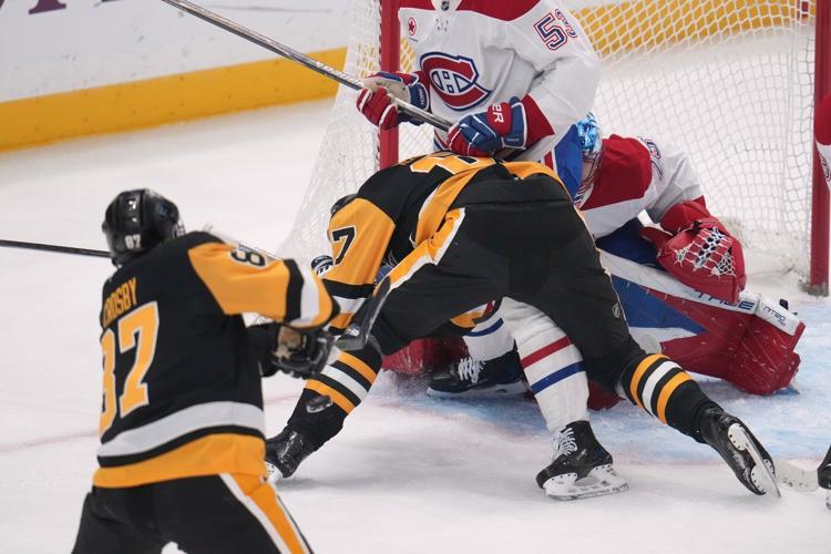 Crosby breaks Lemieux's scoring record, Penguins beat Canadiens 4-3 in shootout