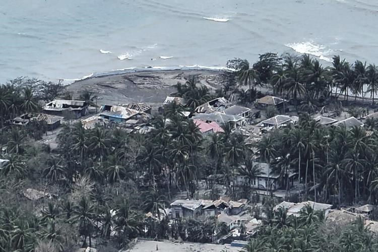 Indonesia's Mount Ruang erupts again, spewing ash and peppering villages with debris