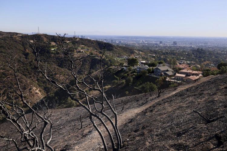 New wildfire warnings issued and more power is shut off as winds rise in Southern California