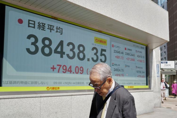 Asian shares gain after Wall Street's rally, but hopes are tempered by trade war uncertainties