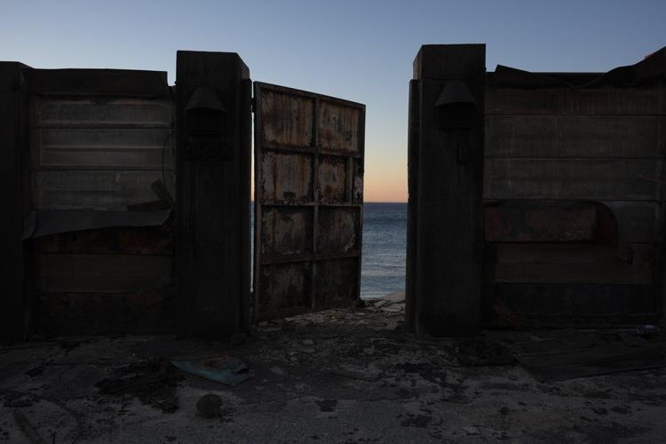 Firefighters report progress against LA blazes as winds pick up again