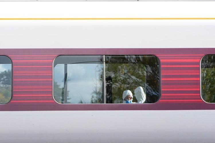 Police rule out terrorism in stabbing attack on UK train after 2 men are arrested