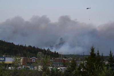 Thousands flee wildfires near Halifax : In The News for May 29