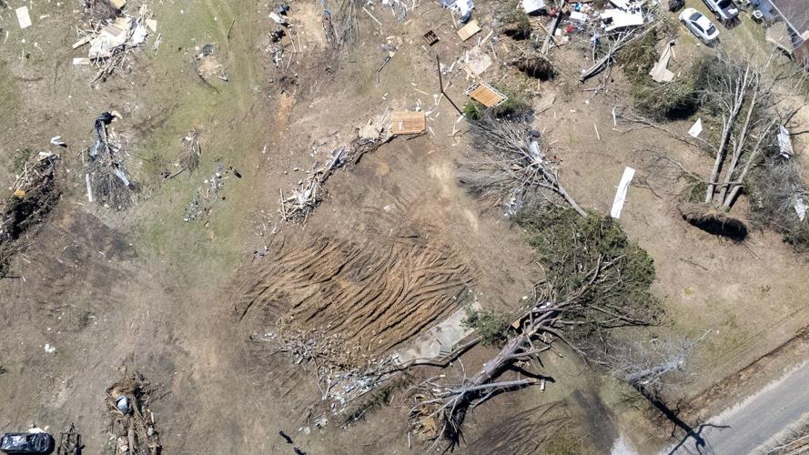 Residents pick up the pieces after devastating storms scour the US South and Midwest