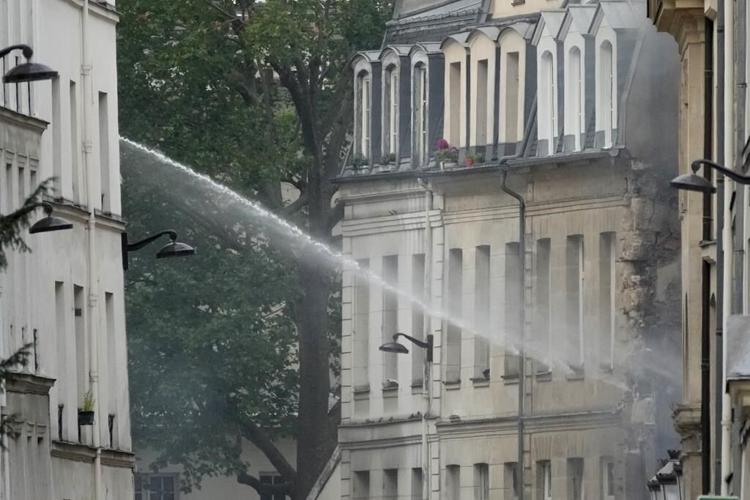 Explosion hits a building in Paris, injuring four people. Police are trying to determine the cause