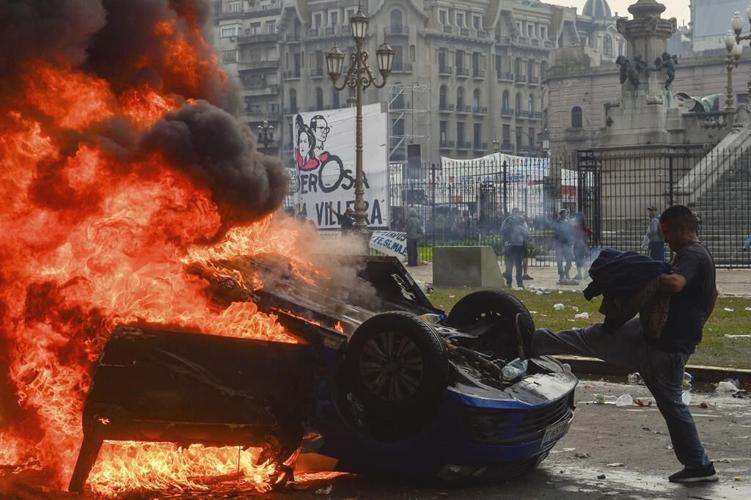 Argentine riot police disperse protesters with water cannons and tear gas ahead of key Senate vote