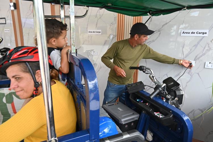 A solar-powered charging station in central Cuba brings life to a darkened island