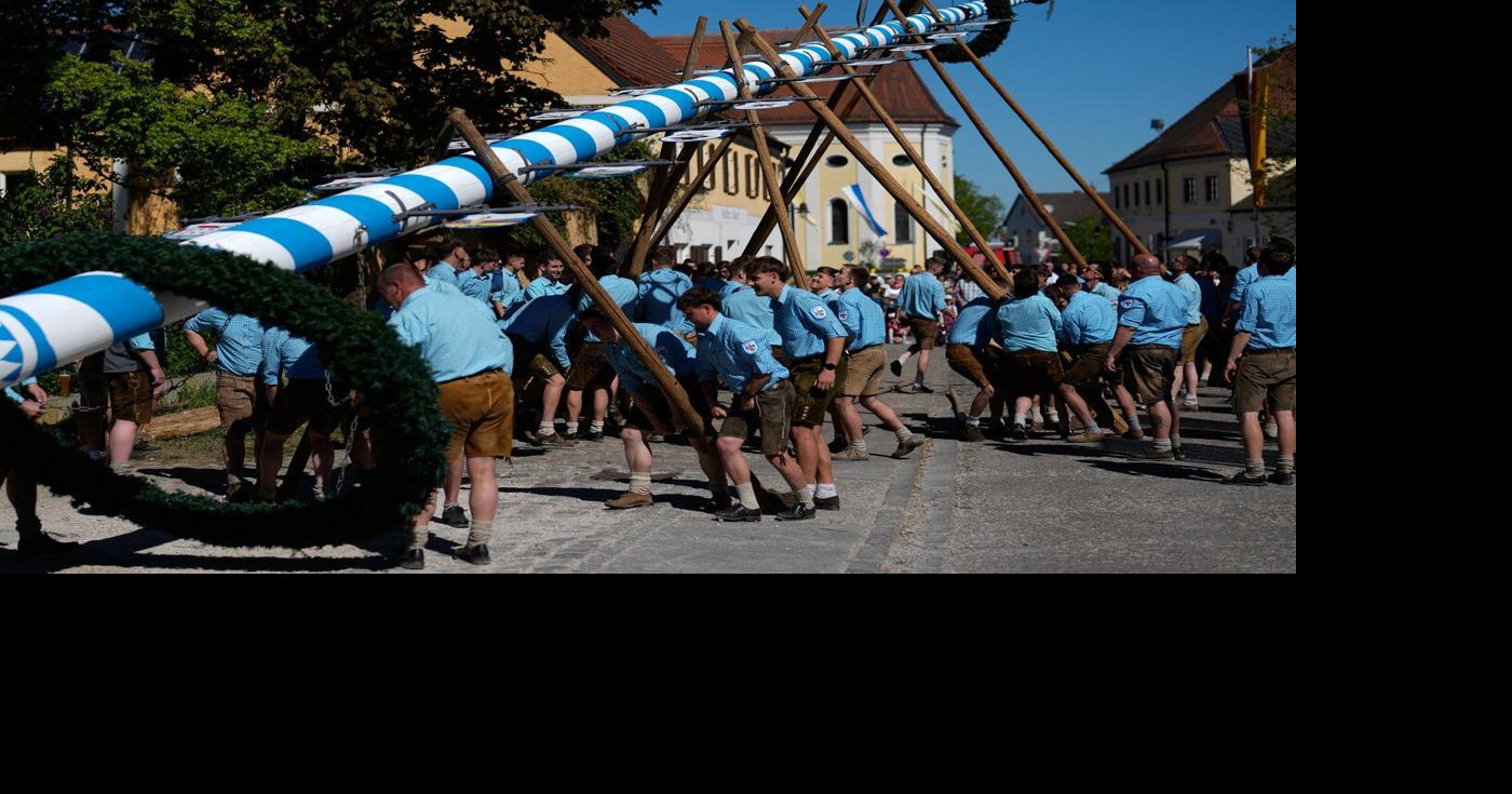 Beer, music and shouts of 'Hau-Ruck' as a Bavarian village raises its ...