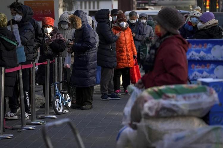 China eases virus controls amid effort to head off protests