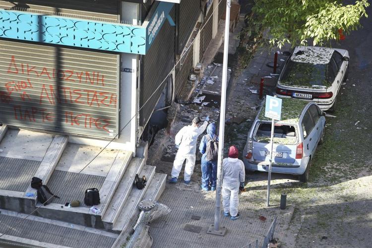 Woman dies when a bomb she is carrying explodes in the Greek city of Thessaloniki, police say