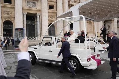 Pope takes cellphone call during general audience, meets with clergy abuse survivors