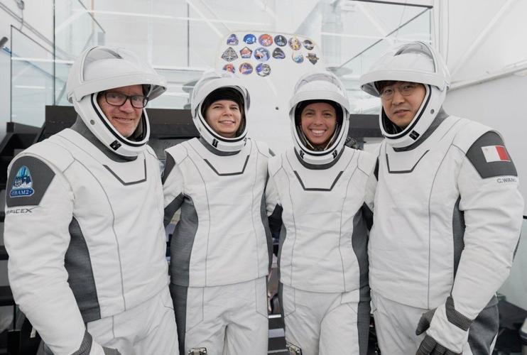 Four space tourists return to Earth after a private flight over the poles