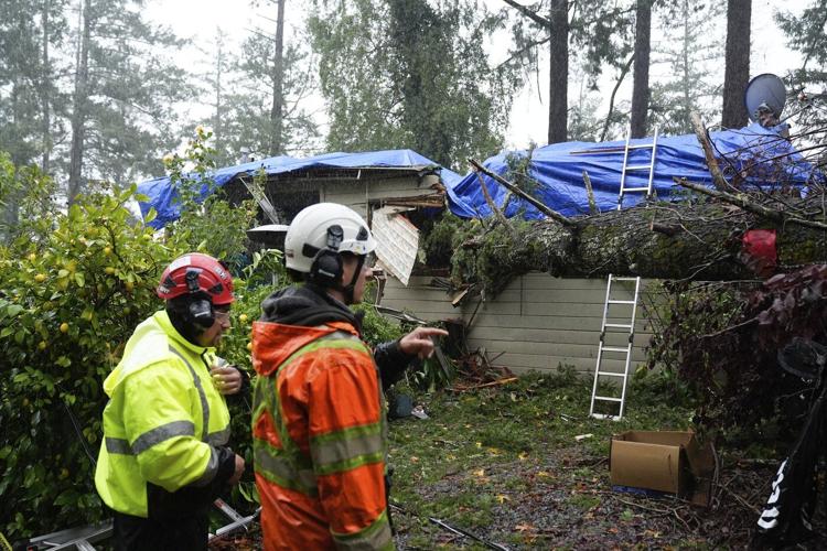 Storm dumps record rain and heavy snow on Northern California. Many in Seattle still without power