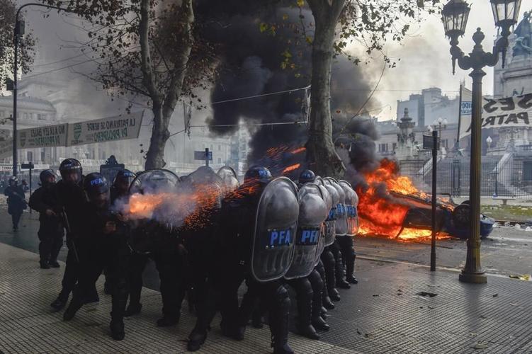 Argentine riot police disperse protesters with water cannons and tear gas ahead of key Senate vote