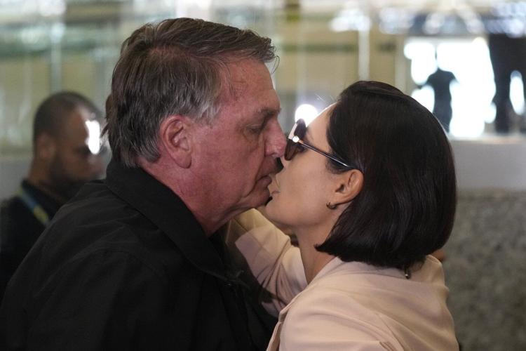 Banned from traveling, Brazil's Bolsonaro sees off his wife heading to Trump’s inauguration