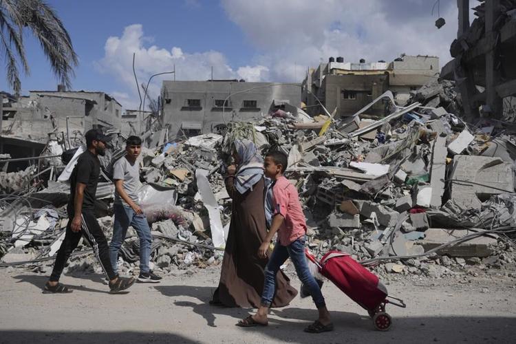 Israel will let Egypt deliver some aid to Gaza, as doctors struggle to treat hospital blast victims