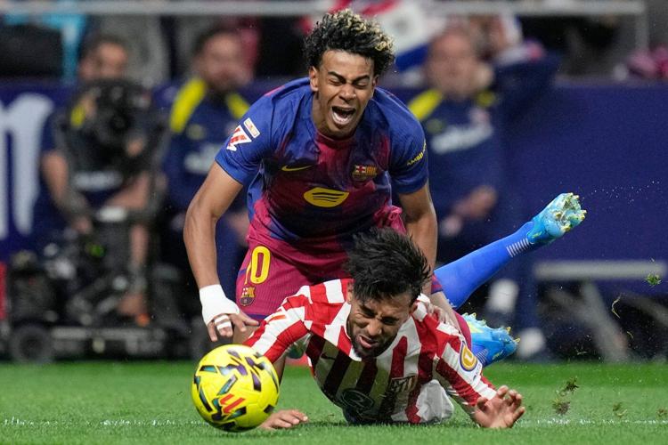 Barcelona overcomes 10-man Atletico and boosts La Liga lead after Real Madrid loses